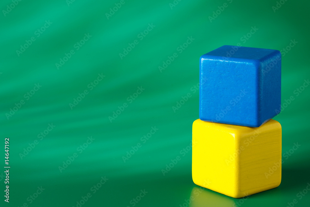 Obraz premium Blue & yellow blocks on green background 2