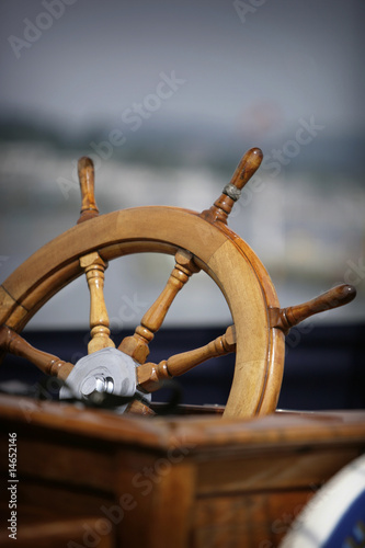 wooden steering wheel on an old sail boat