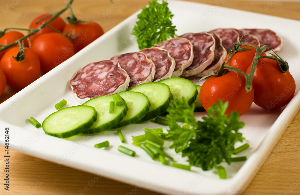 Salami with fresh vegetables Salami with fresh vegetables