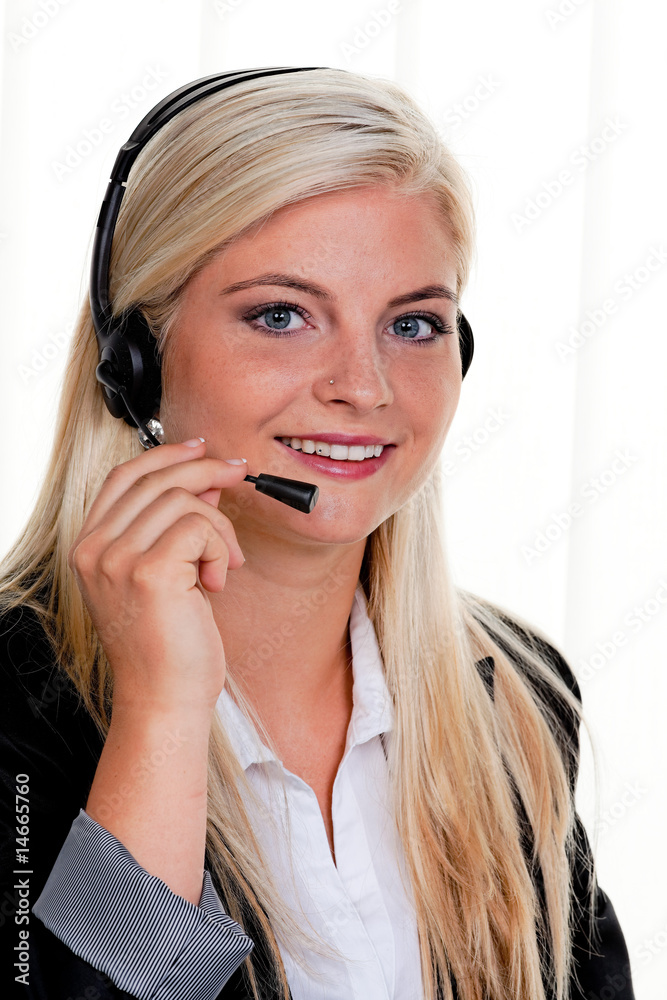 Woman with telephone headset in a call center Woman with telephone headset in a call center