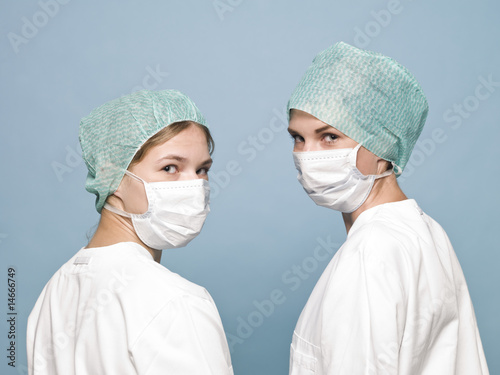 Two nurses with surgical masks