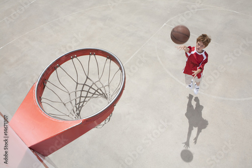 boy making jump shot