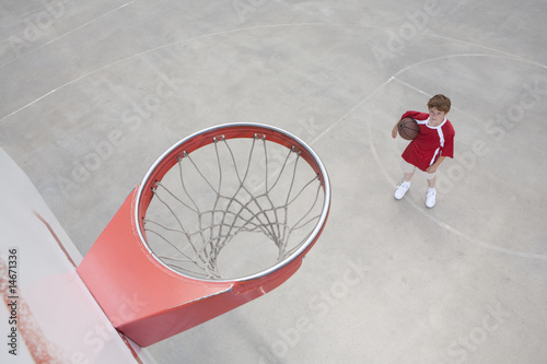 Boy on basket ball court