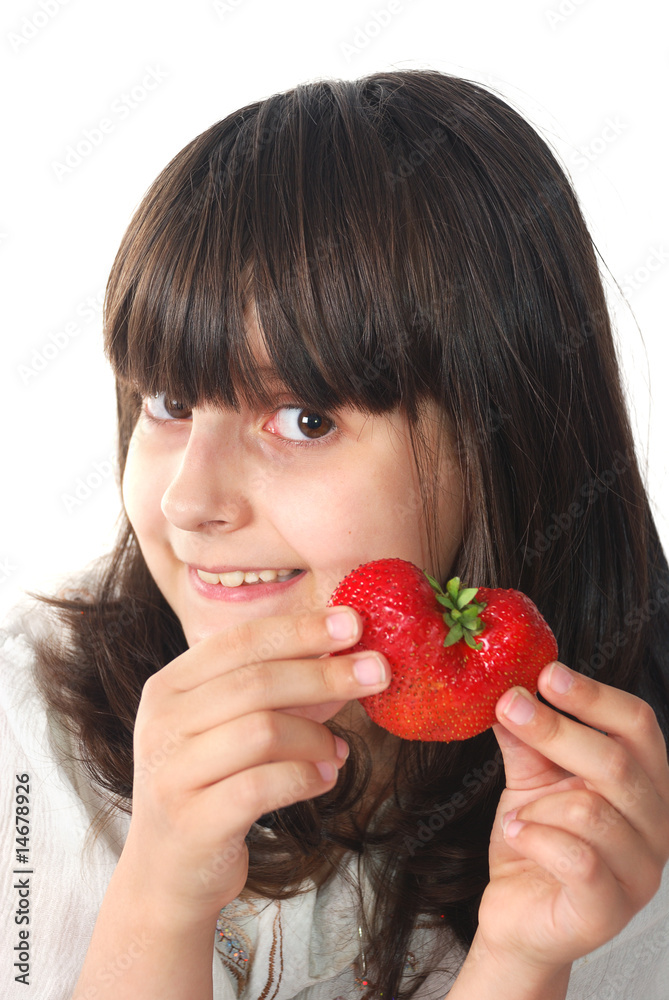 Smiling child with heart strawberry Smiling child with heart strawberry