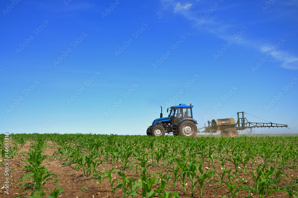Tractor plowing the fields horizontal Tractor plowing the fields horizontal