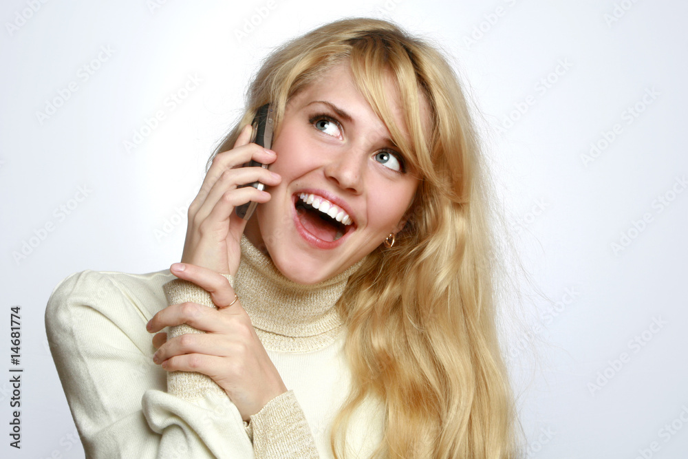 Beautiful woman speaks on a mobile telephone Beautiful woman speaks on a mobile telephone