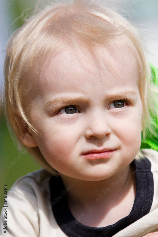 Little boy in outdoor sittings Little boy in outdoor sittings