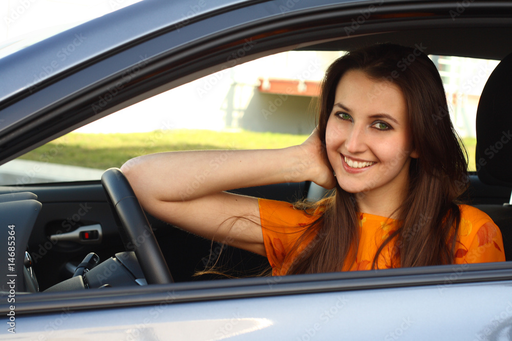 a young woman with her car