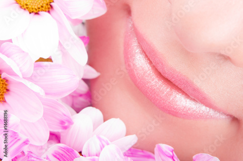 Smile of young woman with flowers