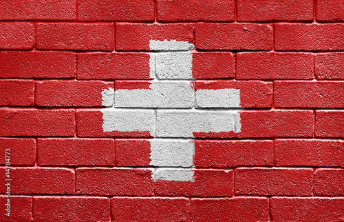 Flag of Switzerland on a brick wall