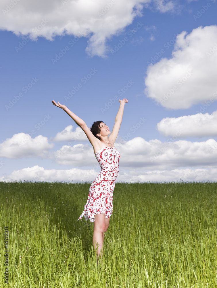 Young woman standing on a field Young woman standing on a field