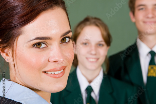 Tableau sur toile beautiful female teacher with students