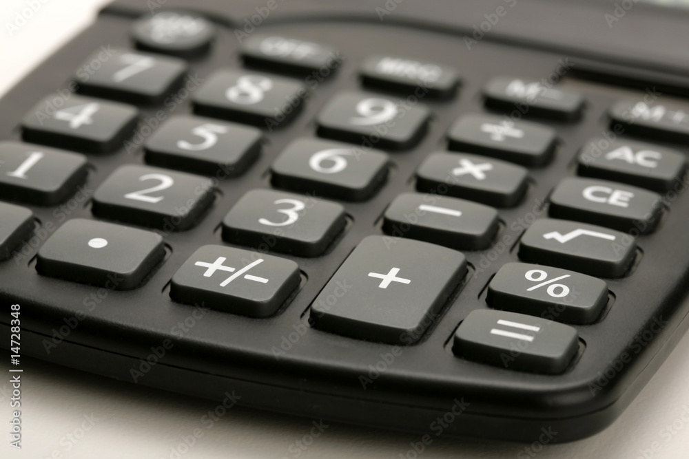 closeup of black calculator on white background closeup of black calculator on white background