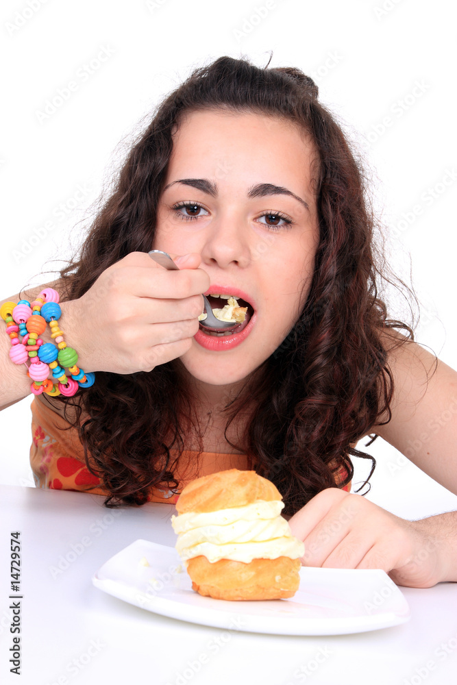 Young girl eating cake