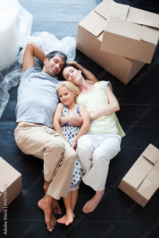 Parents and daughter lying on the floor Parents and daughter lying on the floor