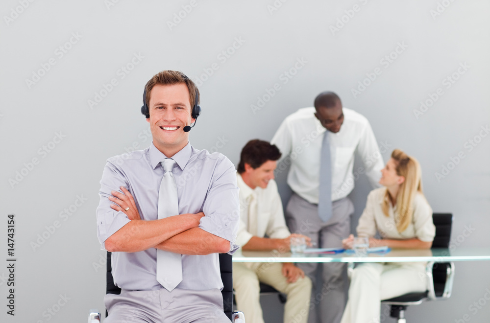 Young and handsome businessman with a headset on Young and handsome businessman with a headset on