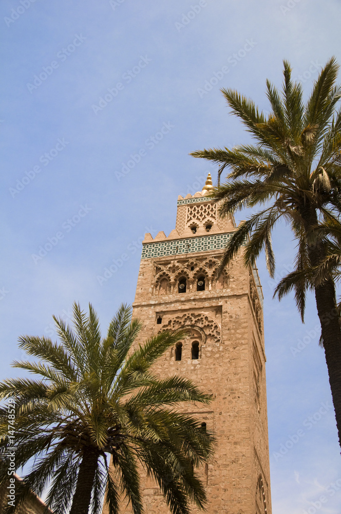 koutubia mosque minaret with palm trees in koutubia gardens marr