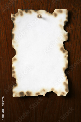 Grunge paper on wooden board