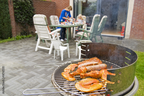 Meat and kebabs on barbecue. photo