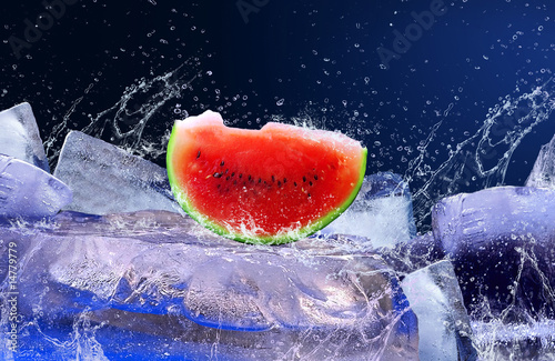 Water drops around watermelon on the ice
