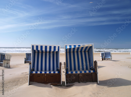 beach chairs on a deserted sunny beach