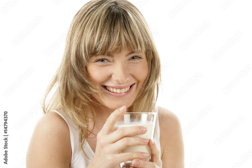 Laughing young woman holding glass of milk Laughing young woman holding glass of milk