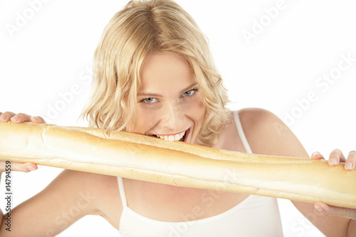 Hungry woman biting baguette photo