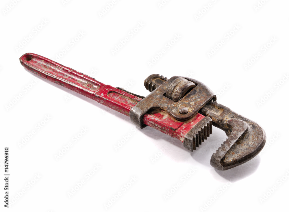 Old and rusty Stilson wrench with red aged handler Old and rusty Stilson wrench with red aged handler