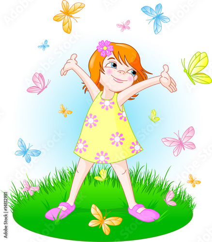 Cute little girl standing on the summer meadow