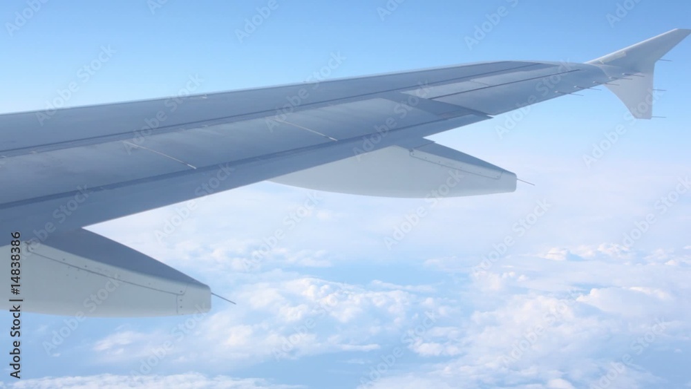 Plane wing over clouds Plane wing over clouds