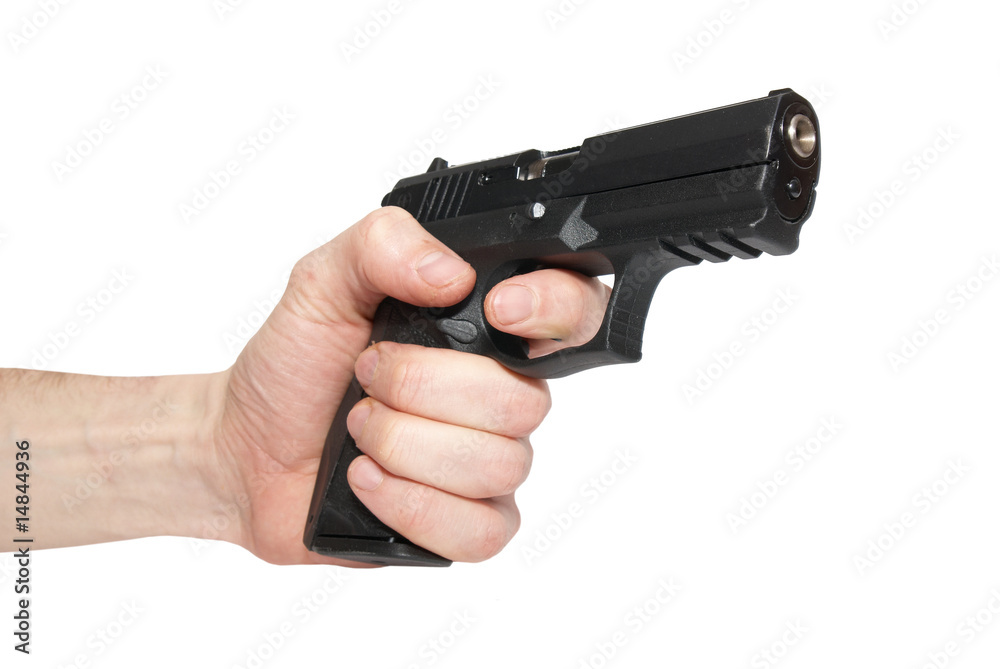Black gun in a hand Black gun in a hand