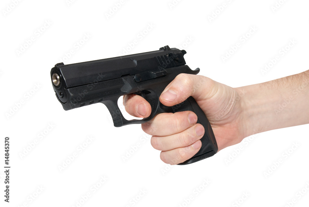 Black gun in a hand Black gun in a hand
