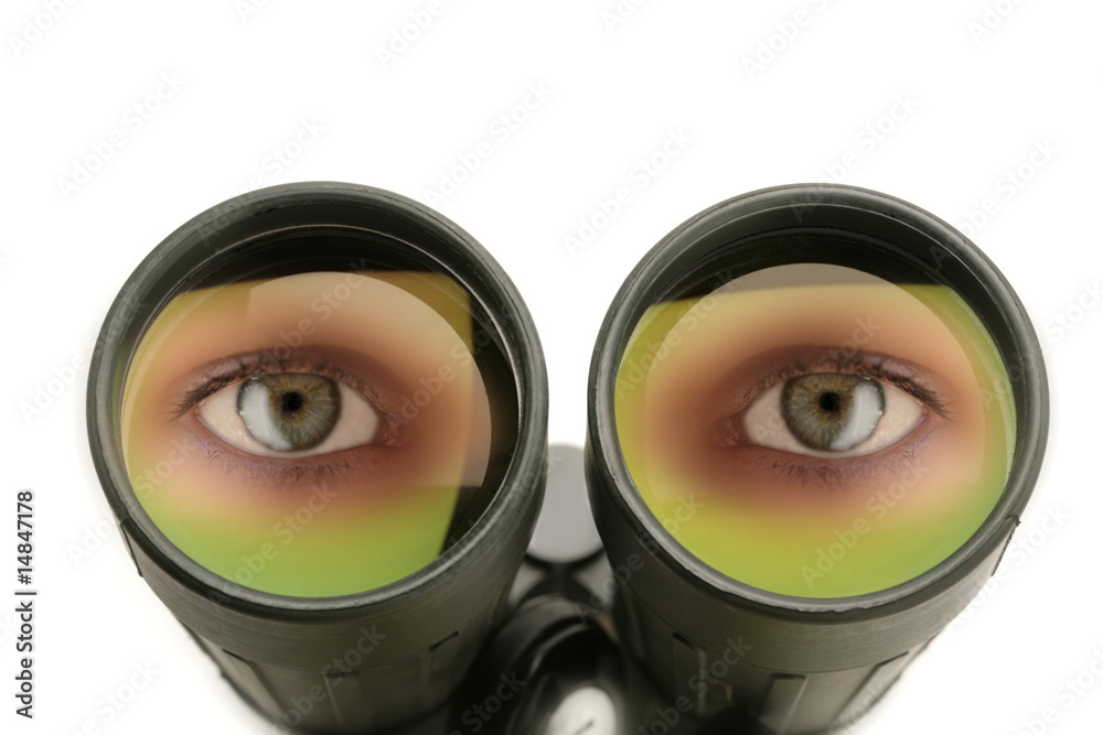 closeup of the lenses of a binocular with eyes closeup of the lenses of a binocular with eyes