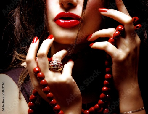 Pretty woman with a red necklace
