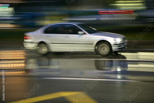 Car moving in rainy night motion blur