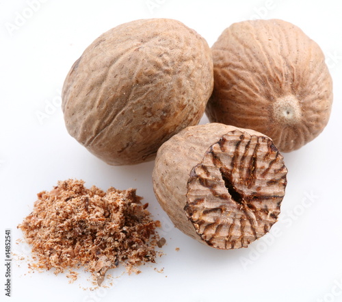 Nutmeg on a white background photo