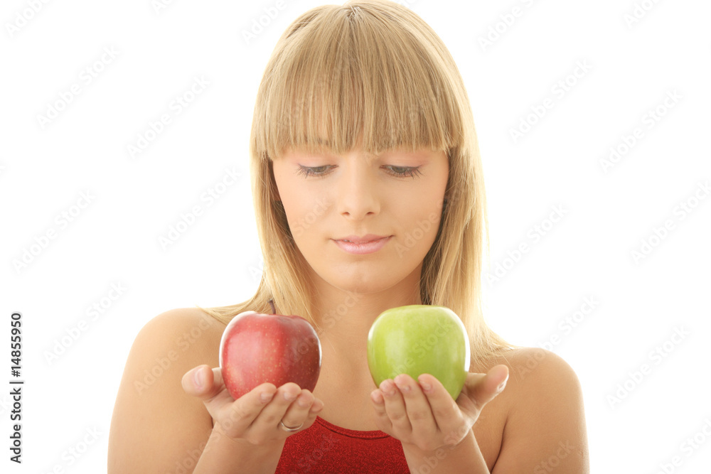 Young blond woman with red and green apples Young blond woman with red and green apples