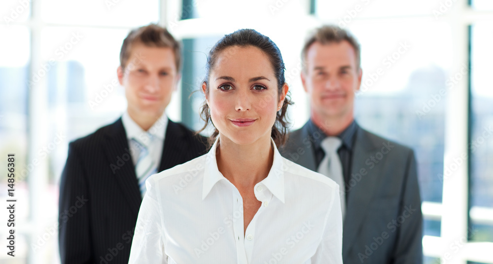 Beautiful businesswoman in front of her team Beautiful businesswoman in front of her team