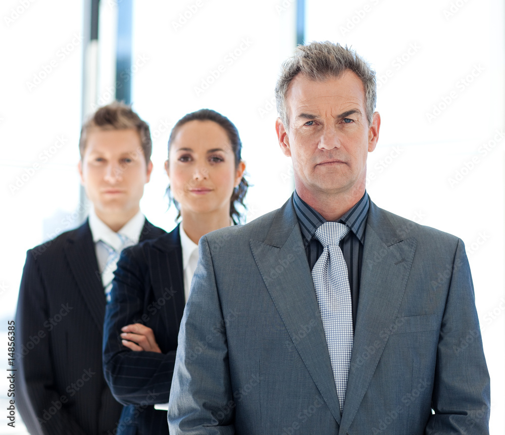 Serious Businessman leading a business team Serious Businessman leading a business team