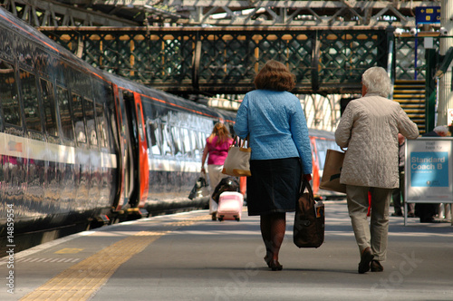 Two ladies about to board a train