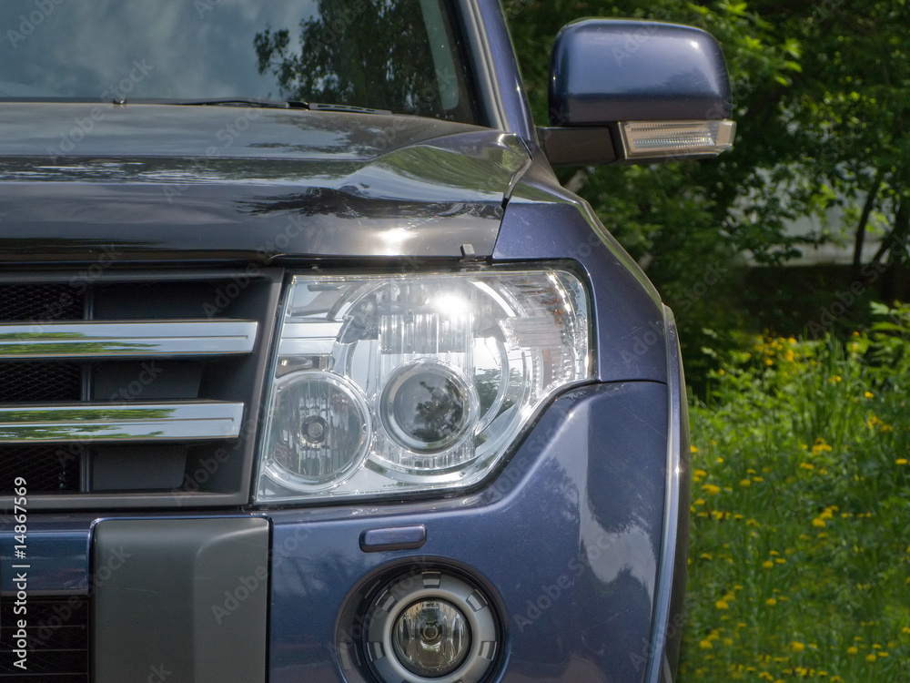 Fototapeta premium Car headlight and bumper