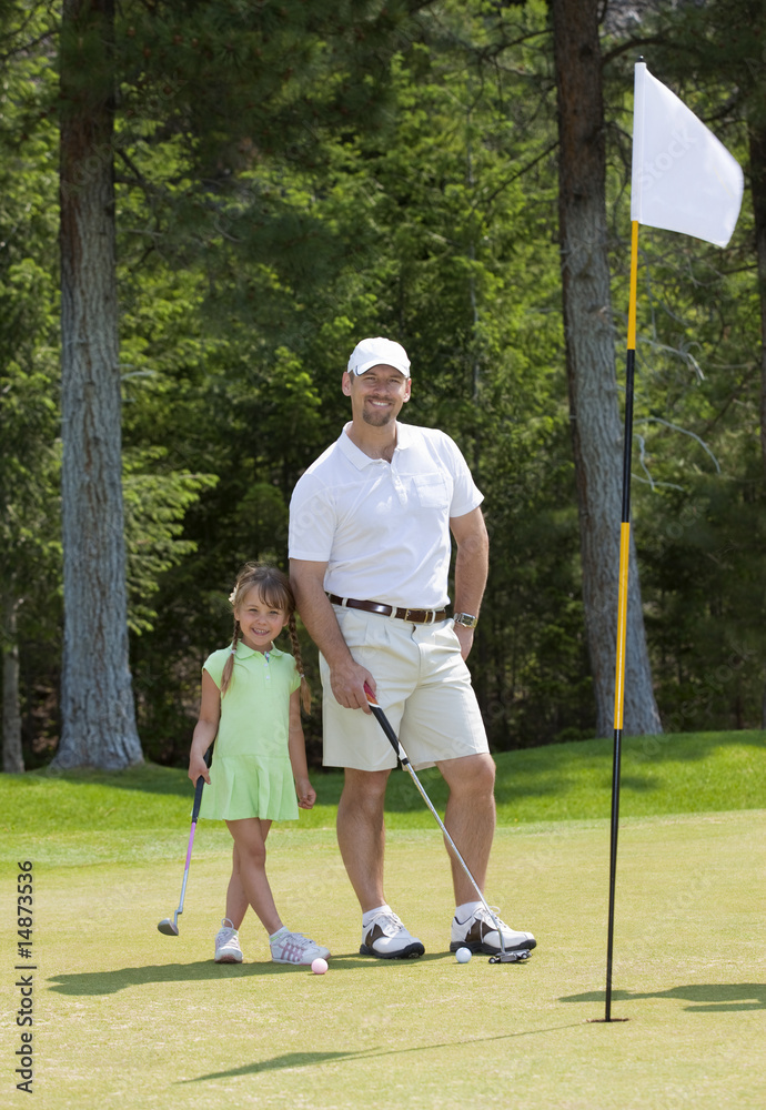 Father and Daughter Golfing