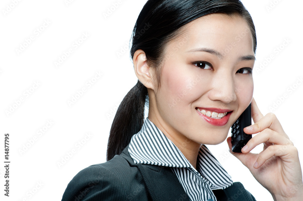 An attractive businesswoman with phone An attractive businesswoman with phone