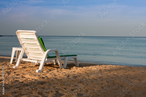 a chair facing the sea