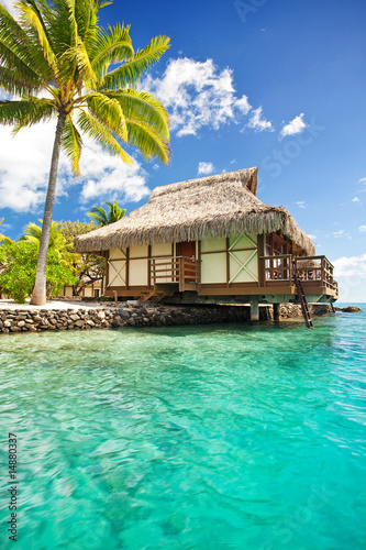 Over water bungalow with steps into lagoon