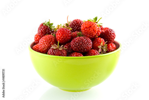 Green bowl with fresh and tasty strawberries on white background