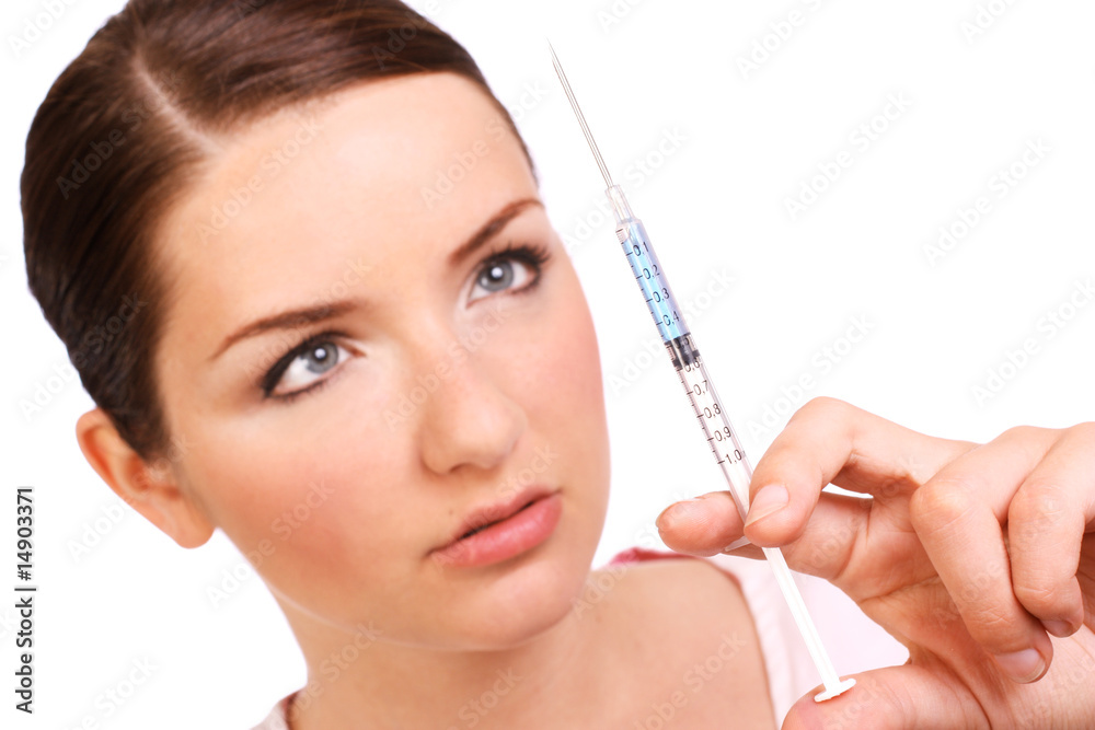 Woman looking at a syringe