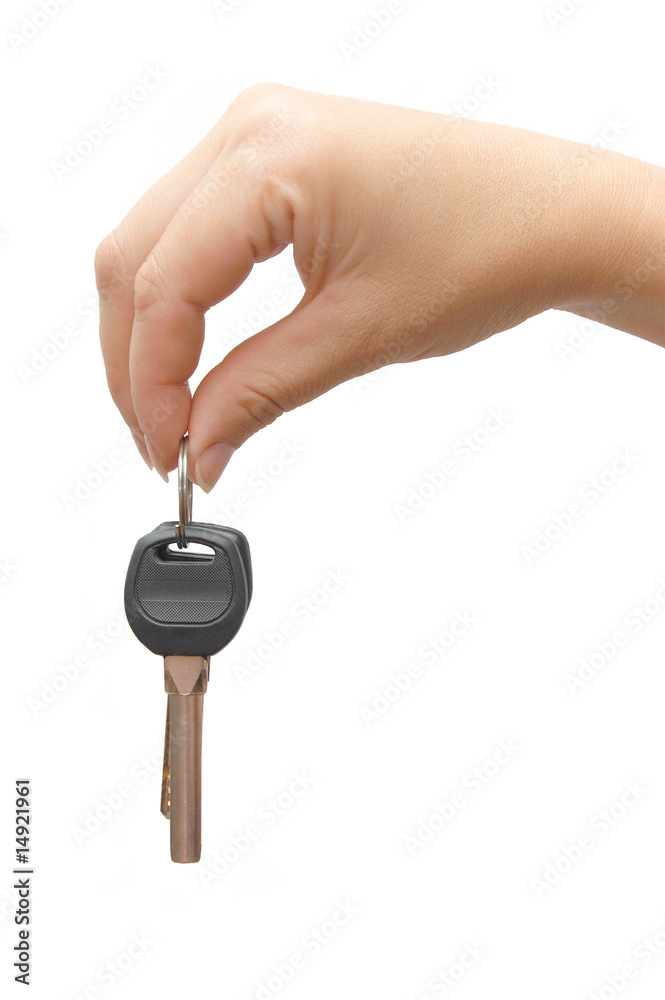 Woman hand and key isolated on white background Woman hand and key isolated on white background
