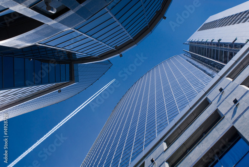 Flying airplane and office buildings