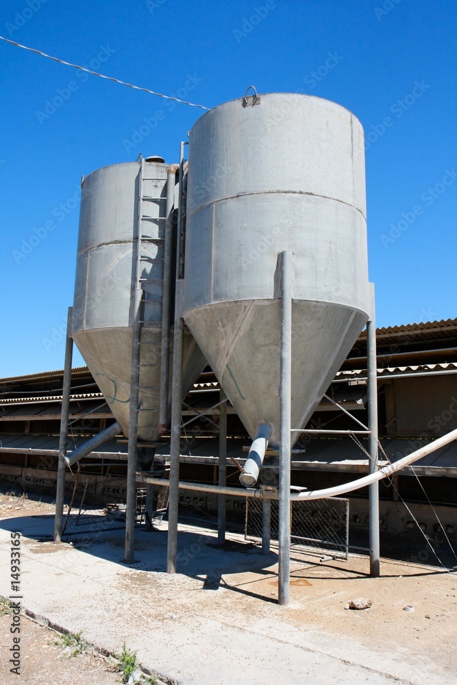 Obraz premium Two small tower silos on farm